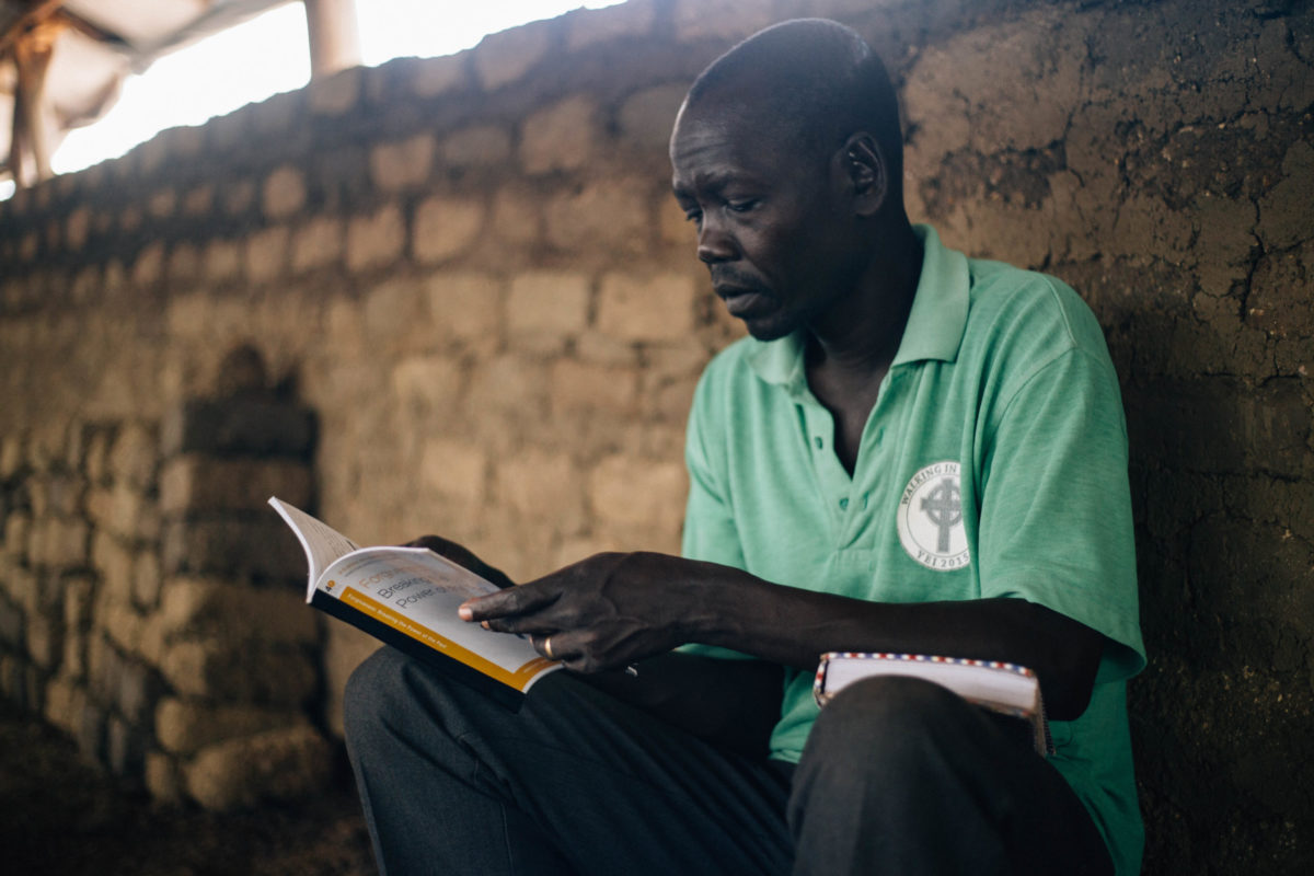 Man reading a Bible Study