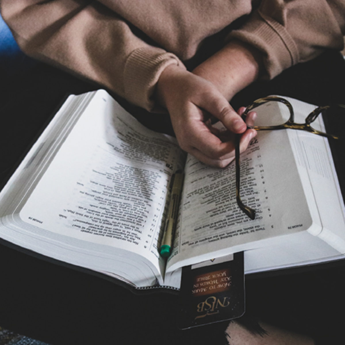 A woman reads her New Inductive Study Bible